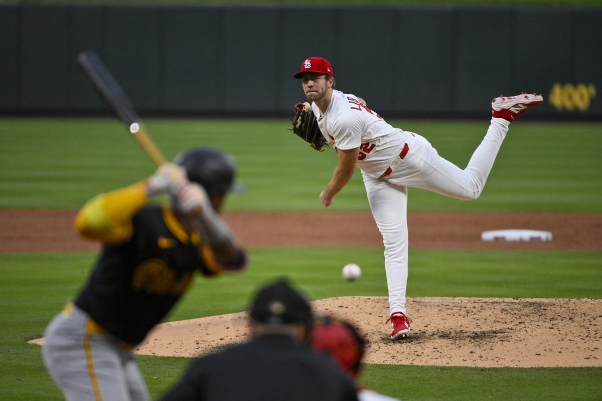 May 6, 2025; St. Louis, Missouri, USA;  St. Louis Cardinals starting pitcher Matthew Liberatore (52) pitches against Pittsburgh Pirates designated hitter Andrew McCutchen (22) during the third inning at Busch Stadium. Mandatory Credit: Jeff Curry-Imagn Images