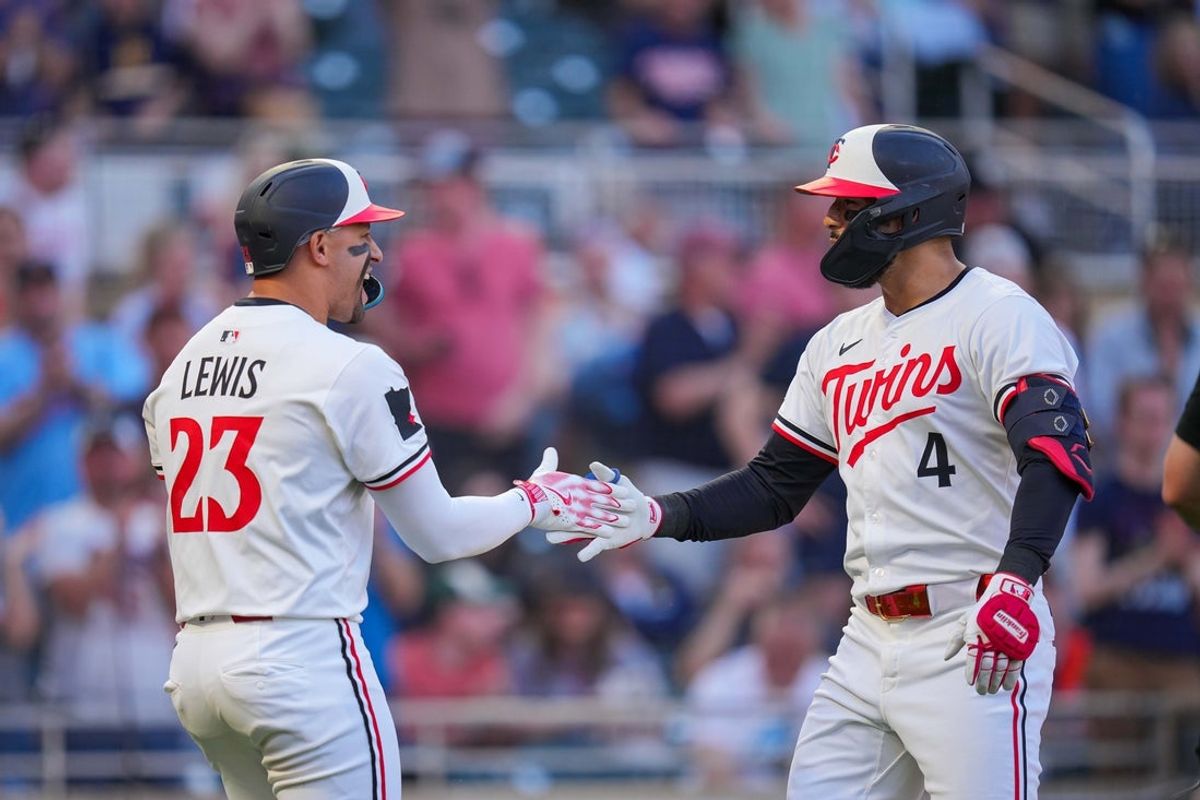 May 6, 2025; Minneapolis, Minnesota, USA; Minnesota Twins shortstop Carlos Correa (4) celebrates hitting a home run with designated hitter Royce Lewis (23) against the Baltimore Orioles in the third inning at Target Field. Mandatory Credit: Brad Rempel-Imagn Images