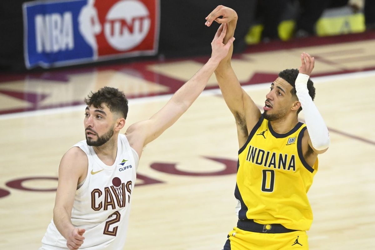 May 6, 2025; Cleveland, Ohio, USA; Cleveland Cavaliers guard Ty Jerome (2) defends Indiana Pacers guard Tyrese Haliburton (0) on a follow through for a game-winning three-point basket in the fourth quarter during game two of the second round of the 2025 NBA Playoffs at Rocket Arena. Mandatory Credit: David Richard-Imagn Images