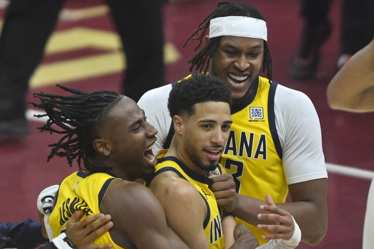 May 6, 2025; Cleveland, Ohio, USA; Indiana Pacers guard Tyrese Haliburton (center) celebrates the game-winning three-point basket with forward Aaron Nesmith (23) and center Myles Turner (33) after game two of the second round of the 2025 NBA Playoffs against the Cleveland Cavaliers at Rocket Arena. Mandatory Credit: David Richard-Imagn Images