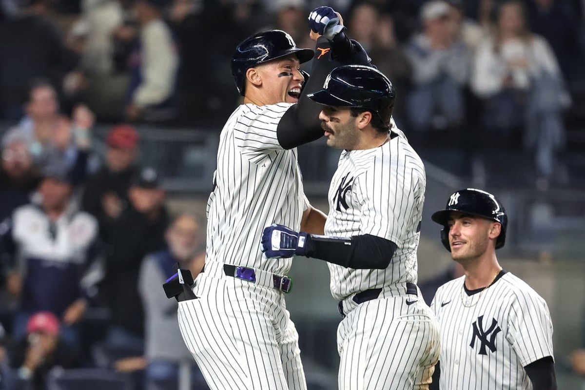 May 6, 2025; Bronx, New York, USA;  New York Yankees catcher Austin Wells (28) celebrates with right fielder Aaron Judge (99) after hitting a grand slam home run in the seventh inning against the San Diego Padres at Yankee Stadium. Mandatory Credit: Wendell Cruz-Imagn Images