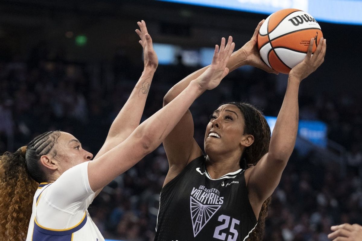 May 6, 2025; San Francisco, CA, USA; Golden State Valkyries forward Monique Billings (25) shoots the basketball against Los Angeles Sparks forward Dearica Hamby (5) during the second quarter at Chase Center. Mandatory Credit: Kyle Terada-Imagn Images