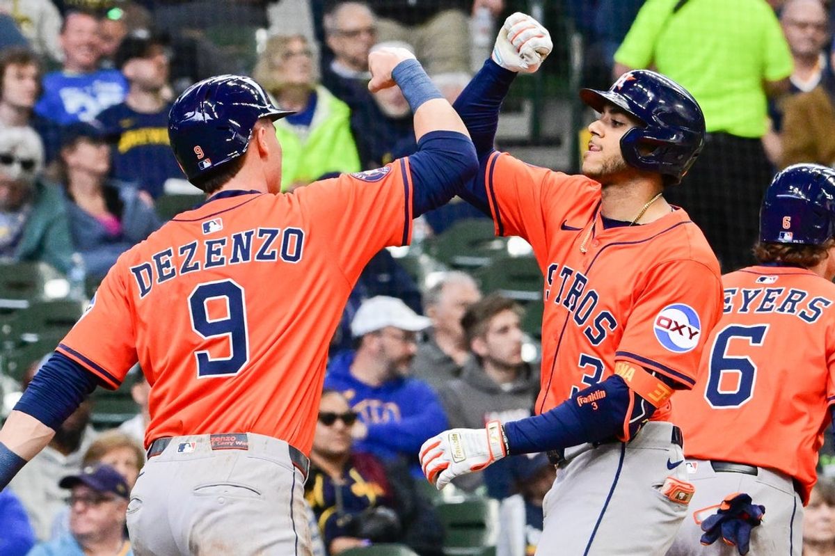 May 7, 2025; Milwaukee, Wisconsin, USA; Houston Astros shortstop Jeremy Pena (3) celebrates with left fielder Zach Dezenzo (9) after hitting a 3-run home run in the sixth inning against the Milwaukee Brewers at American Family Field. Mandatory Credit: Benny Sieu-Imagn Images