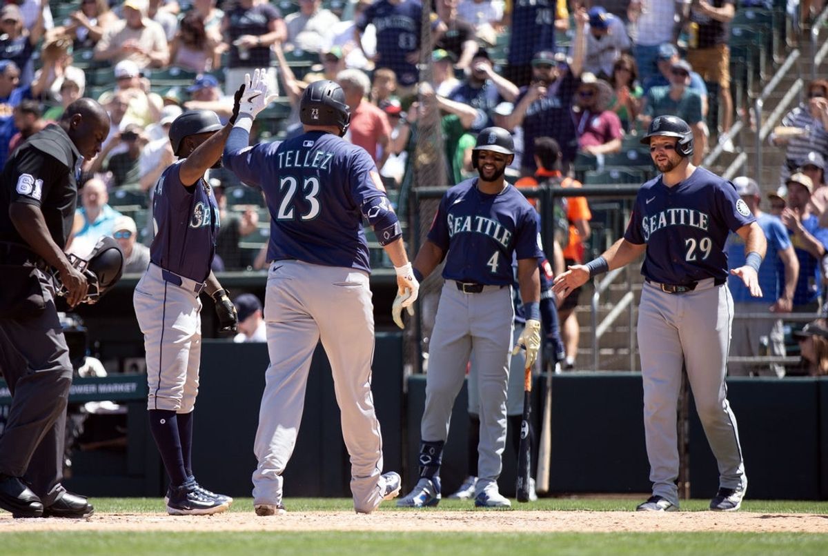 May 7, 2025; West Sacramento, California, USA; Seattle Mariners first baseman Rowdy Tellez (23) is greeted by his teammates after hitting a three-run home run against the Athletics during the sixth inning at Sutter Health Park. Mandatory Credit: D. Ross Cameron-Imagn Images