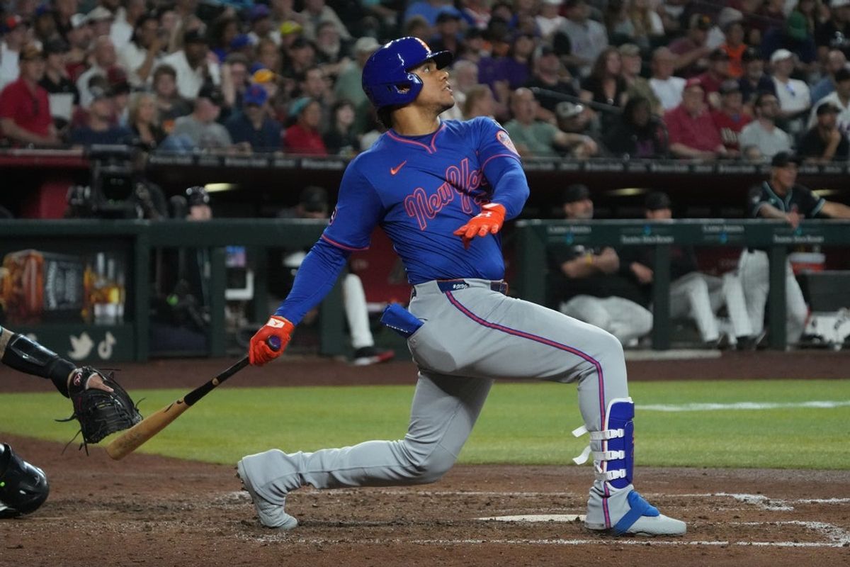 May 7, 2025; Phoenix, Arizona, USA; New York Mets outfielder Juan Soto (22) hits a solo home run against the Arizona Diamondbacks in the sixth inning at Chase Field. Mandatory Credit: Rick Scuteri-Imagn Images