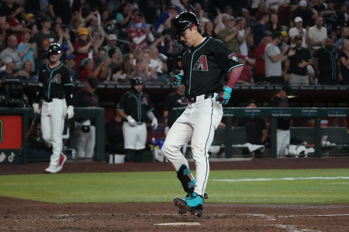 May 7, 2025; Phoenix, Arizona, USA; Arizona Diamondbacks outfielder Corbin Carroll (7) crosses home plate after hitting a solo home run against the New York Mets in the eighth inning at Chase Field. Mandatory Credit: Rick Scuteri-Imagn Images