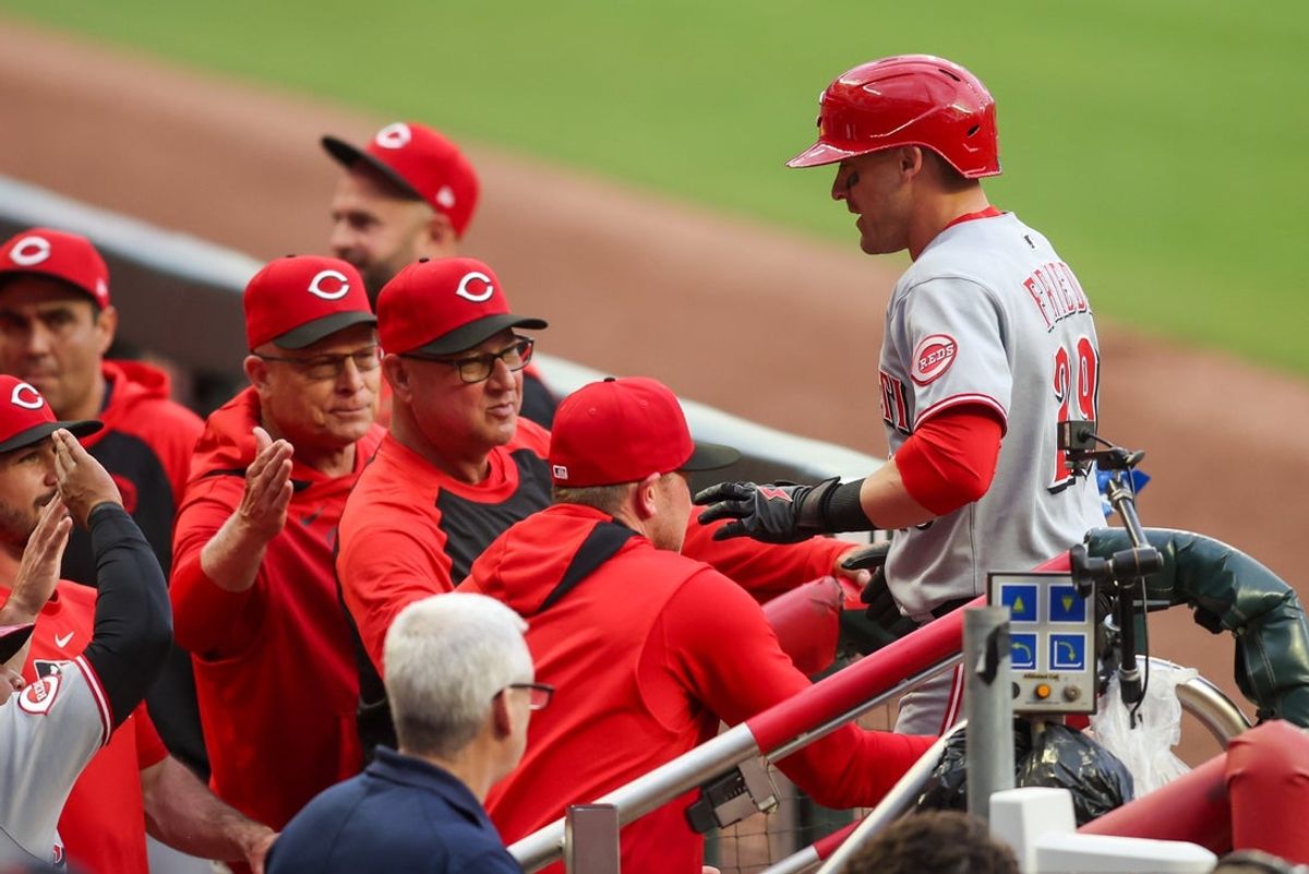 May 7, 2025; Atlanta, Georgia, USA; Cincinnati Reds center fielder TJ Friedl (29) celebrates with manager Terry Francona (77) after a home run against the Atlanta Braves in the first inning at Truist Park. Mandatory Credit: Brett Davis-Imagn Images