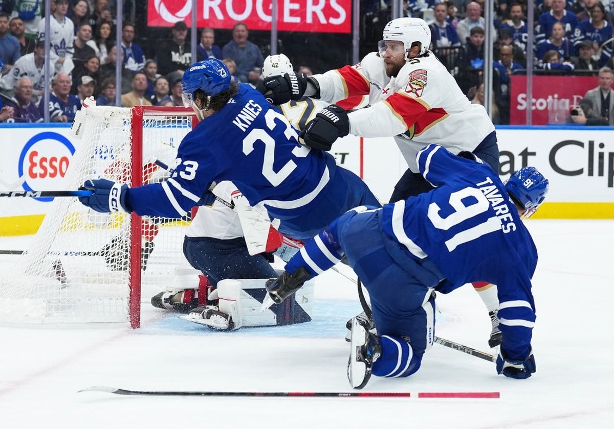 May 7, 2025; Toronto, Ontario, CAN; Toronto Maple Leafs left wing Matthew Knies (23) battles in front of the net with Florida Panthers defenseman Aaron Ekblad (5) during the first period in game two of the second round of the 2025 Stanley Cup Playoffs at Scotiabank Arena. Mandatory Credit: Nick Turchiaro-Imagn Images