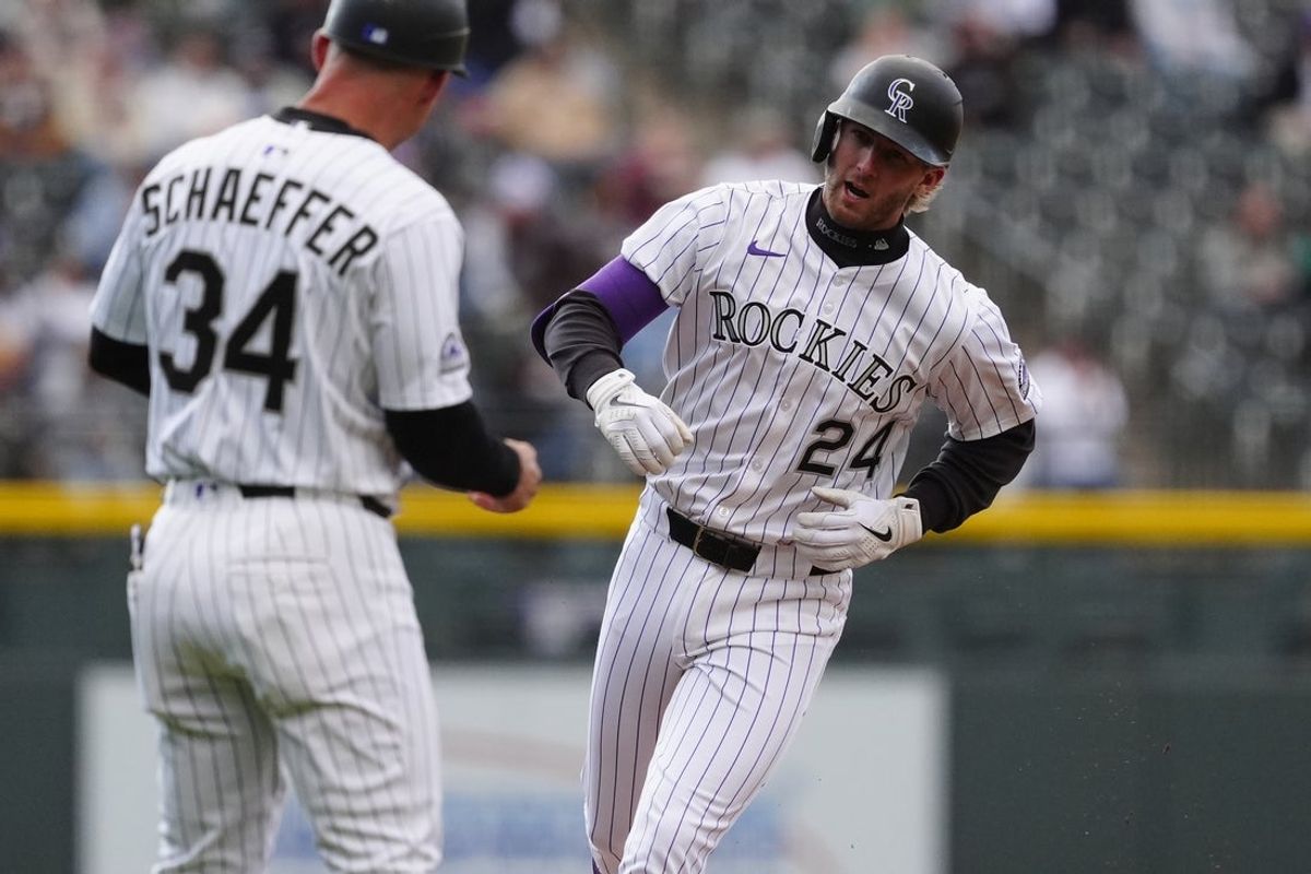 May 7, 2025; Denver, Colorado, USA; Colorado Rockies third base Ryan McMahon (24) runs off a two run home run in the first inning against the Detroit Tigers at Coors Field. Mandatory Credit: Ron Chenoy-Imagn Images