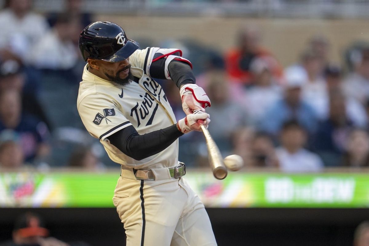May 7, 2025; Minneapolis, Minnesota, USA; Minnesota Twins center fielder Byron Buxton (25) hits a single against the Baltimore Orioles in the fifth inning at Target Field. Mandatory Credit: Jesse Johnson-Imagn Images