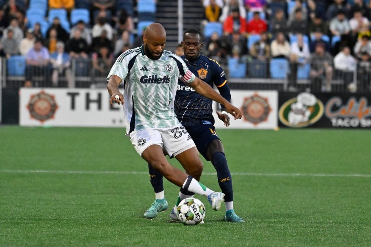 May 7, 2025; Pawtucket, Rhode Island, USA; New England Revolution defender Andrew Farrell (88) controls the ball in front of Rhode Island FC forward Jojea Kwizera (17) during the first half at Centreville Bank Stadium. Mandatory Credit: Eric Canha-Imagn Images