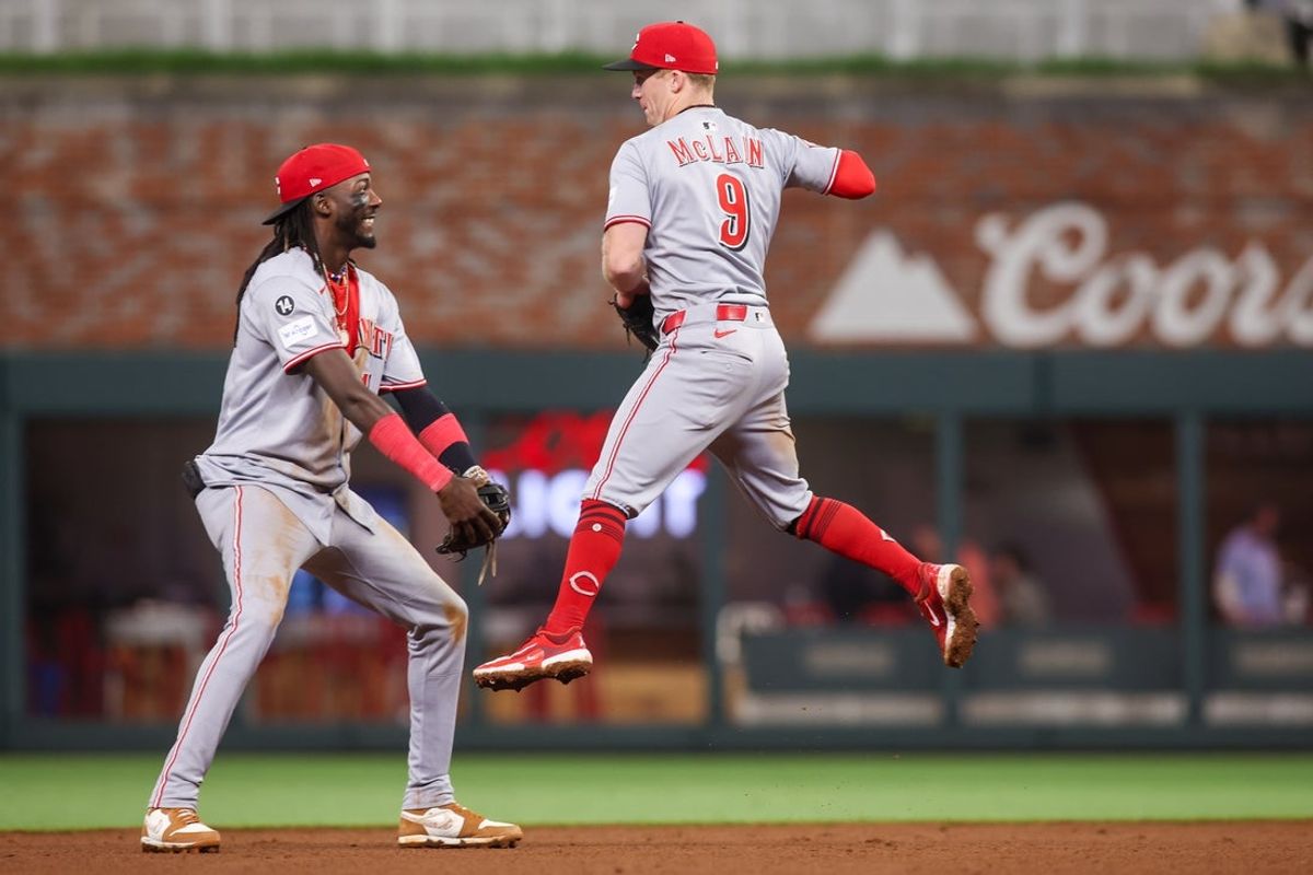 May 7, 2025; Atlanta, Georgia, USA; Cincinnati Reds shortstop Elly De La Cruz (44) and second baseman Matt McLain (9) celebrate after a victory over the Atlanta Braves at Truist Park. Mandatory Credit: Brett Davis-Imagn Images
