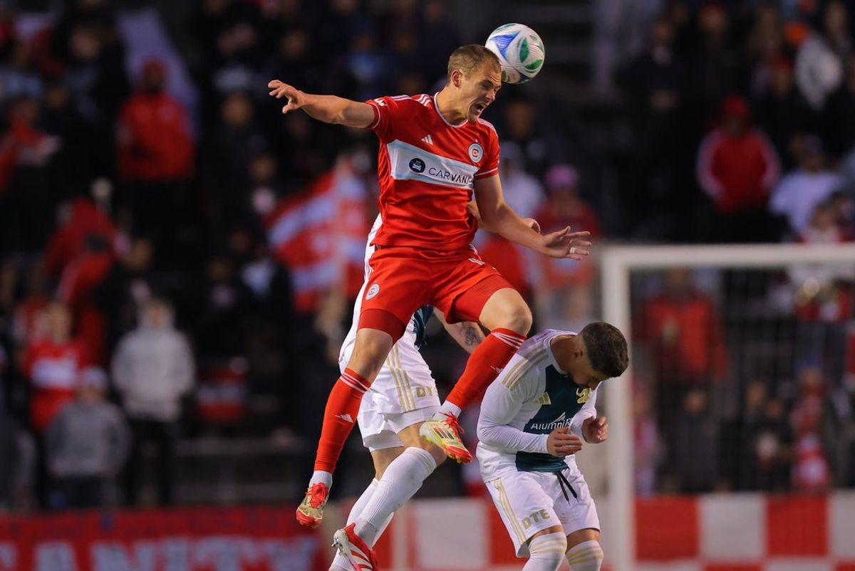 May 7, 2025; Bridgeview, Illinois, USA; Chicago Fire FC forward Tom Barlow (12) heads the ball during the second half against the Detroit City FC at SeatGeek Stadium. Mandatory Credit: Melissa Tamez-Imagn Images