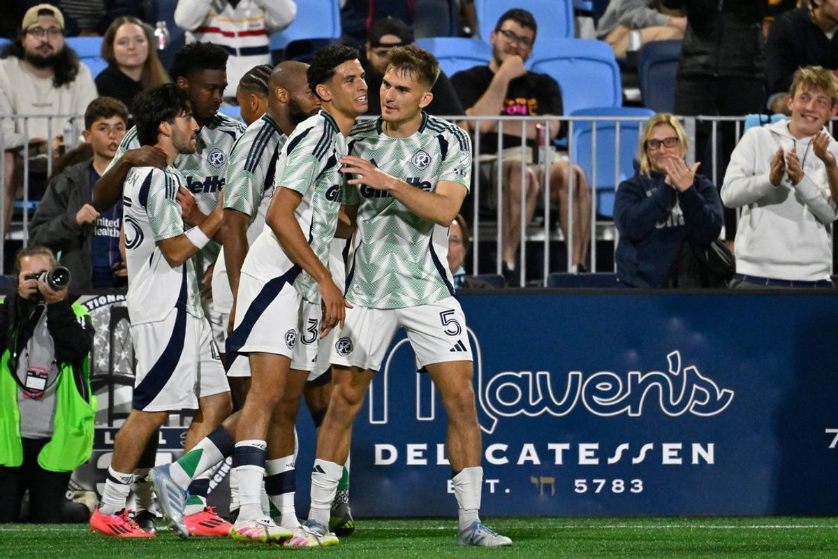 May 7, 2025; Pawtucket, Rhode Island, USA; New England Revolution midfielder Cristiano Oliveira (35) celebrates his goal against the Rhode Island FC with New England Revolution defender Keegan Hughes (5) during the second half at Centreville Bank Stadium. Mandatory Credit: Eric Canha-Imagn Images