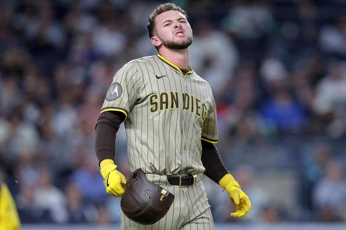 May 7, 2025; Bronx, New York, USA; San Diego Padres center fielder Jackson Merrill (3) reacts after being hit in the arm by a pitch during the tenth inning against the New York Yankees at Yankee Stadium. Mandatory Credit: Brad Penner-Imagn Images