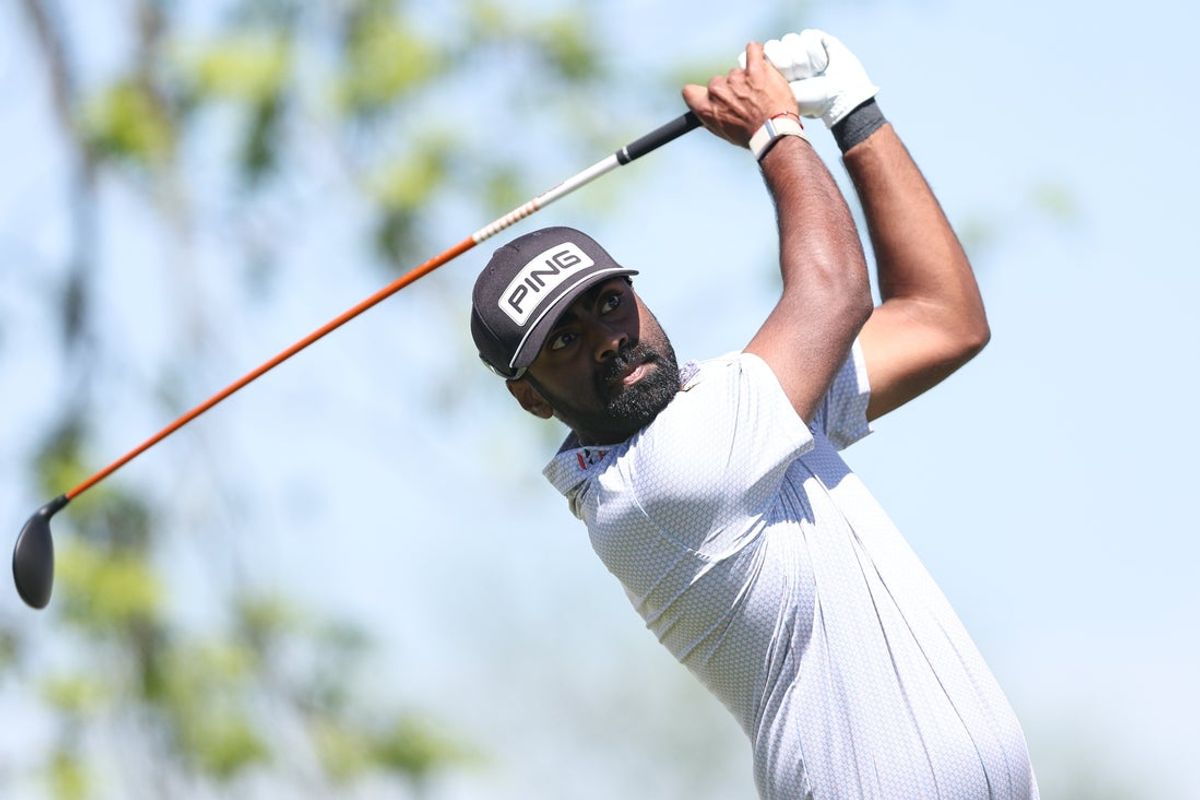 May 8, 2025; Philadelphia, Pennsylvania, USA; Sahith Theegala plays his shot from the first tee during the first round of the Truist Championship golf tournament. Mandatory Credit: Bill Streicher-Imagn Images