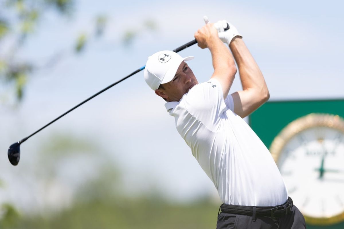 May 8, 2025; Philadelphia, Pennsylvania, USA; Jordan Spieth plays his shot from the first tee during the first round of the Truist Championship golf tournament. Mandatory Credit: Bill Streicher-Imagn Images