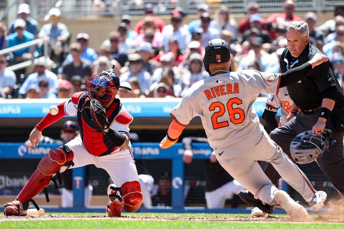 May 8, 2025; Minneapolis, Minnesota, USA; Minnesota Twins catcher Christian Vazquez (8) tags out Baltimore Orioles third baseman Emmanuel Rivera (26) at home plate during the sixth inning at Target Field. Mandatory Credit: Matt Krohn-Imagn Images