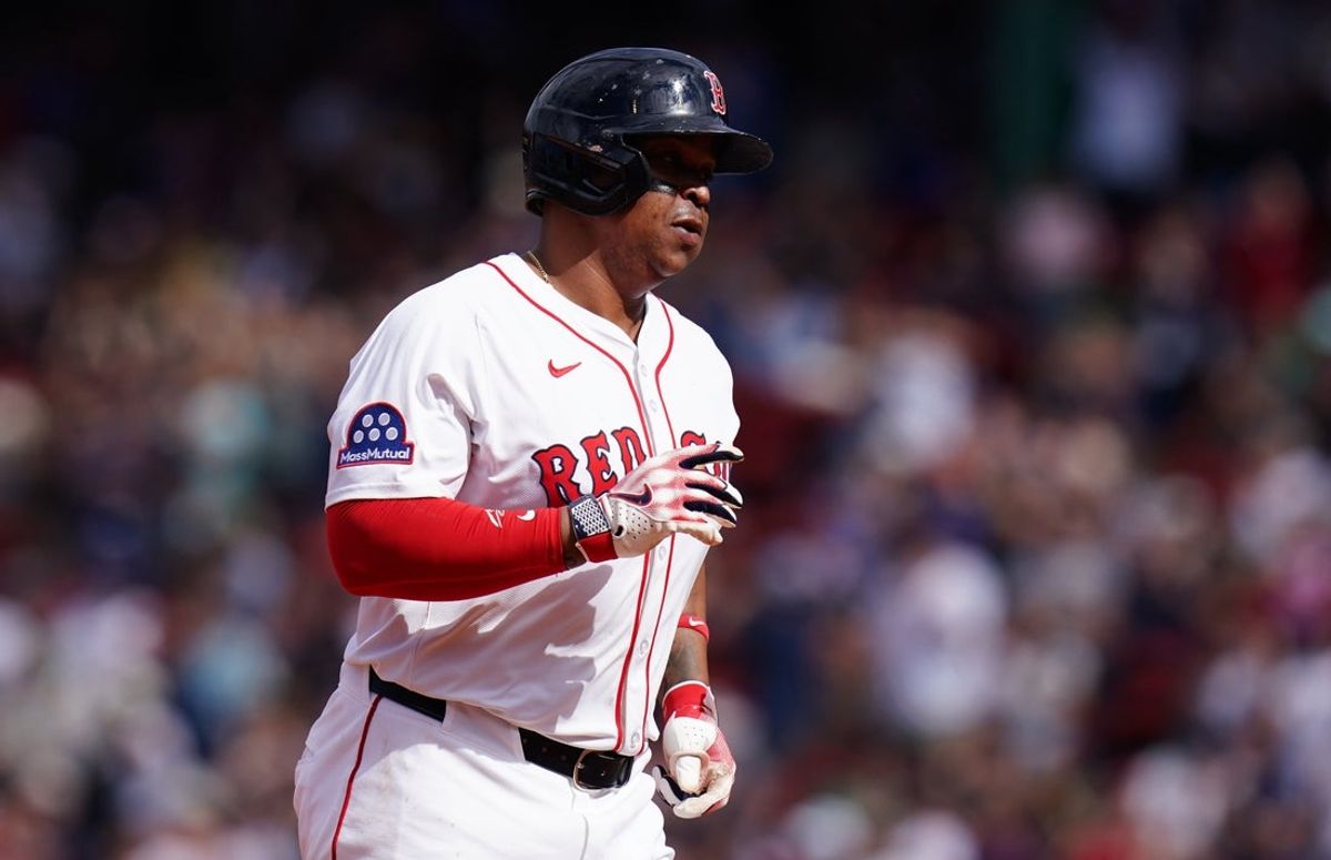 May 8, 2025; Boston, Massachusetts, USA; Boston Red Sox designated hitter Rafael Devers (11) hits a home run against the Texas Rangers in the seventh inning at Fenway Park. Mandatory Credit: David Butler II-Imagn Images