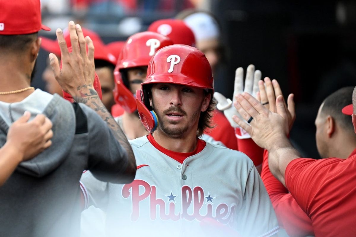 May 8, 2025; St. Petersburg, Florida, USA;  Philadelphia Phillies second baseman Bryson Scott (5) celebrates in the dugout  after scoring a run in the first inning against the Tampa Bay Rays at George M. Steinbrenner Field. Mandatory Credit: Jonathan Dyer-Imagn Images