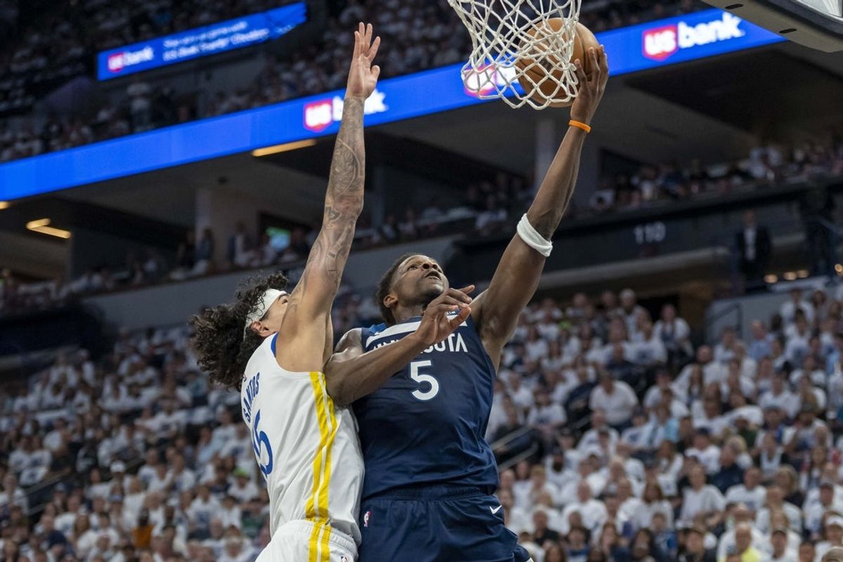 May 8, 2025; Minneapolis, Minnesota, USA; Minnesota Timberwolves guard Anthony Edwards (5) drives to the basket past Golden State Warriors forward Gui Santos (15) and shoots the ball in the first half during game two of the second round for the 2025 NBA Playoffs at Target Center. Mandatory Credit: Jesse Johnson-Imagn Images