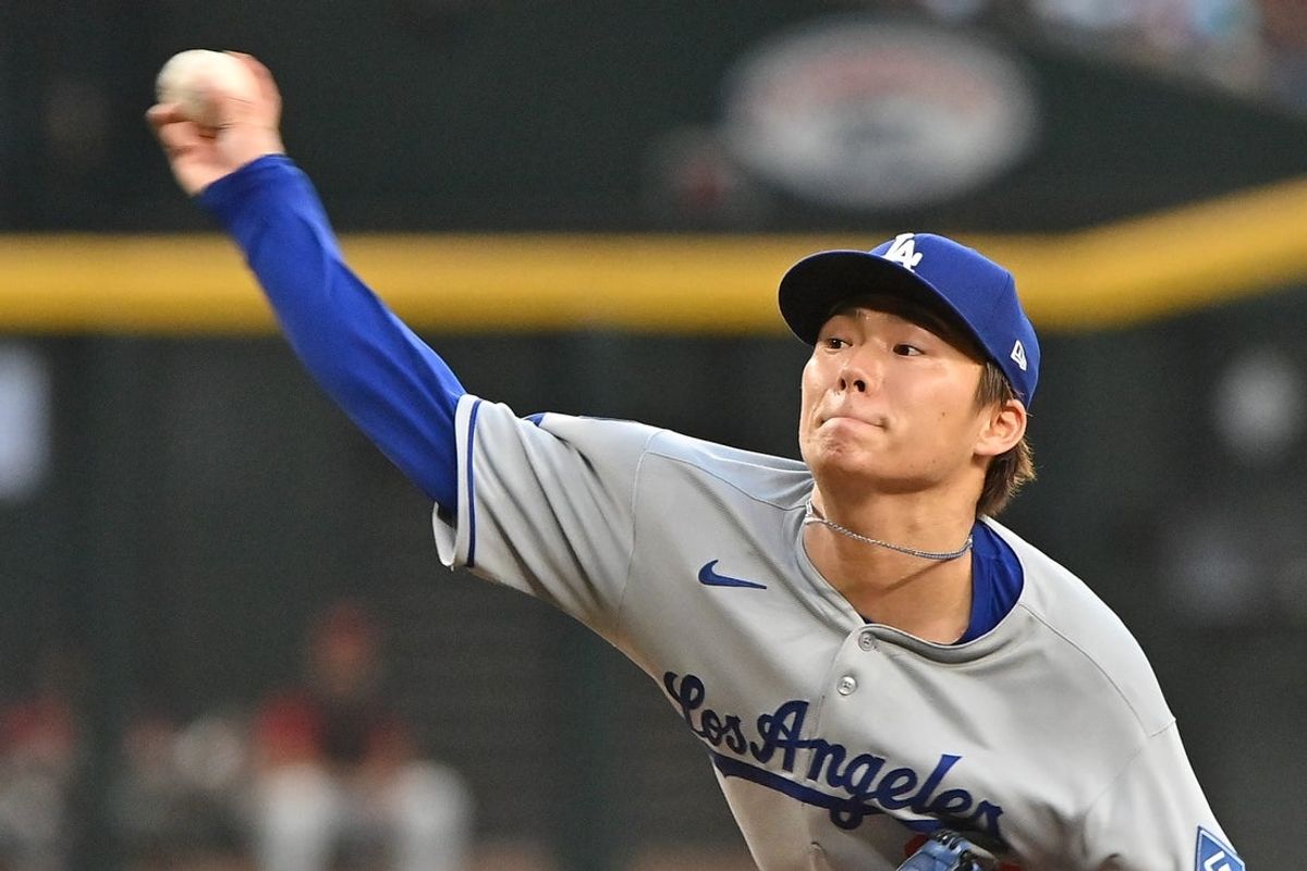 May 8, 2025; Phoenix, Arizona, USA; Los Angeles Dodgers pitcher Yoshinobu Yamamoto (18) throws in the first inning against the Arizona Diamondbacks at Chase Field. Mandatory Credit: Matt Kartozian-Imagn Images