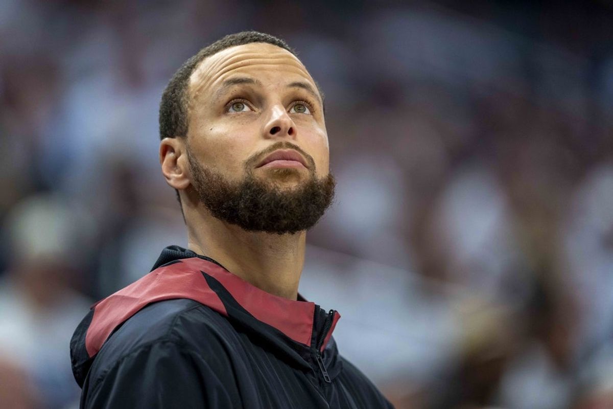 May 8, 2025; Minneapolis, Minnesota, USA; Golden State Warriors guard Stephen Curry (30) looks on from the bench against the Minnesota Timberwolves in the second half during game two of the second round for the 2025 NBA Playoffs at Target Center. Mandatory Credit: Jesse Johnson-Imagn Images