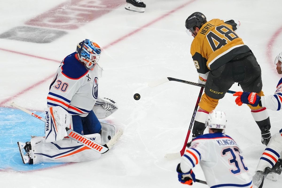 May 8, 2025; Las Vegas, Nevada, USA; Edmonton Oilers goaltender Calvin Pickard (30) makes a save against Vegas Golden Knights center Tomas Hertl (48) during an overtime period of game two of the second round of the 2025 Stanley Cup Playoffs against the Edmonton Oilers at T-Mobile Arena. Mandatory Credit: Stephen R. Sylvanie-Imagn Images