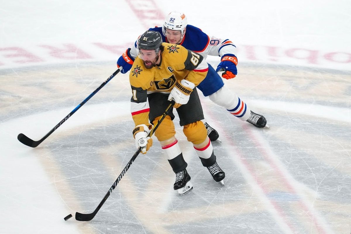 May 8, 2025; Las Vegas, Nevada, USA; Vegas Golden Knights right wing Mark Stone (61) skates away from Edmonton Oilers right wing Vasily Podkolzin (92) during an overtime period of game two of the second round of the 2025 Stanley Cup Playoffs against the Edmonton Oilers at T-Mobile Arena. Mandatory Credit: Stephen R. Sylvanie-Imagn Images