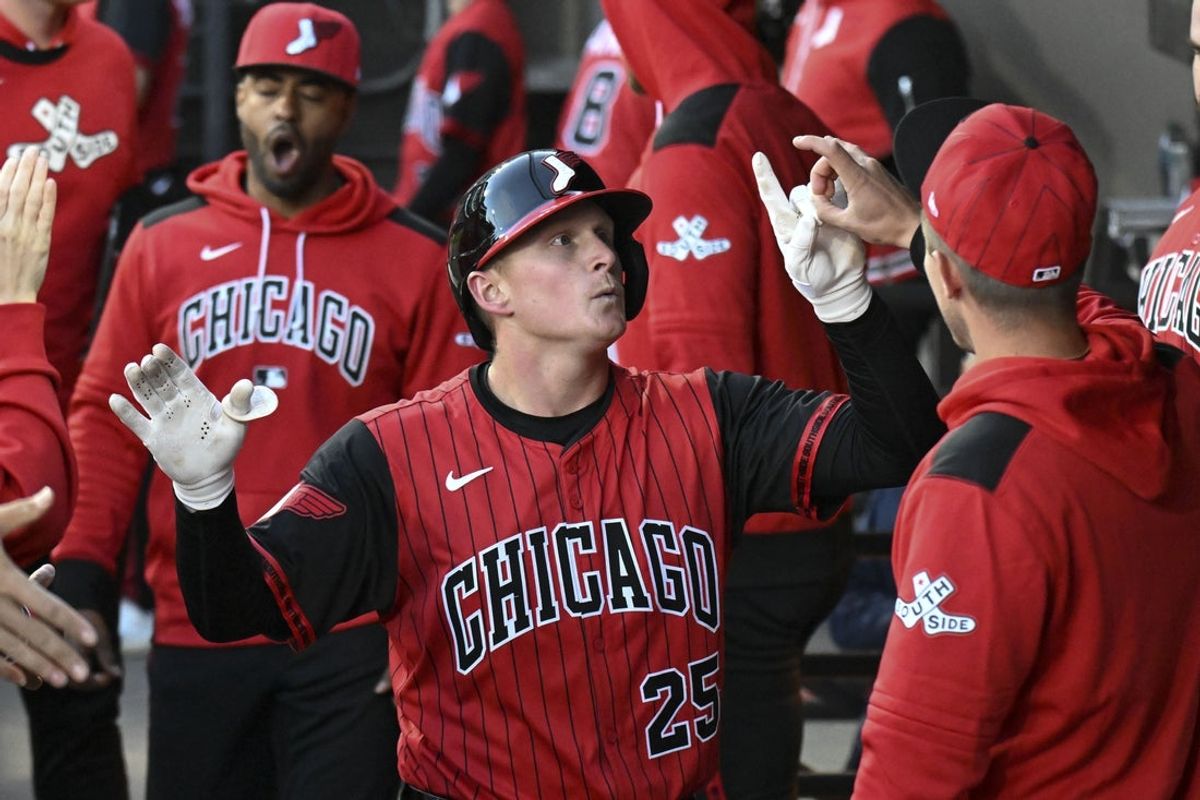 May 9, 2025; Chicago, Illinois, USA;  Chicago White Sox first base Andrew Vaughn (25) celebrates in the dugout after hitting a home run during the second inning at Rate Field. Mandatory Credit: Matt Marton-Imagn Images