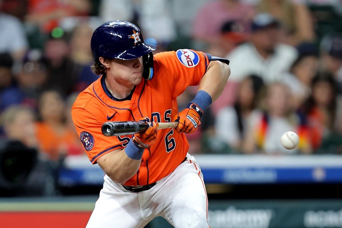May 9, 2025; Houston, Texas, USA; Houston Astros center fielder Jake Meyers (6) bunts against the Cincinnati Reds during the fourth inning at Daikin Park. Mandatory Credit: Erik Williams-Imagn Images