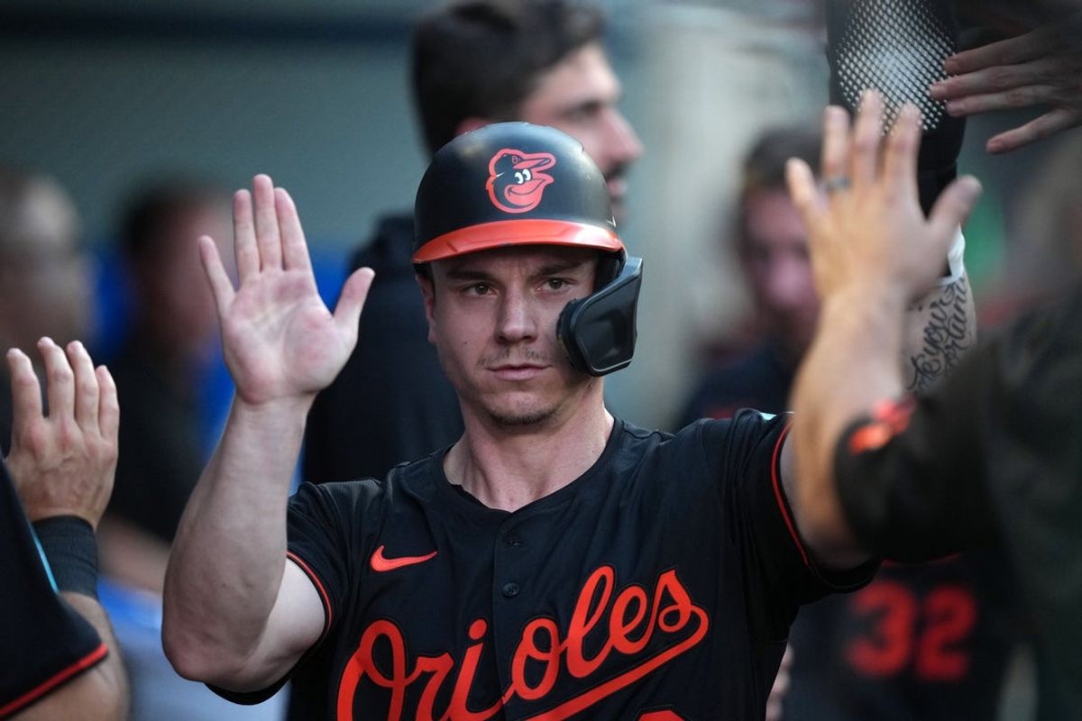 May 9, 2025; Anaheim, California, USA; Baltimore Orioles right fielder Tyler O'Neill (9) celebrates with teammates after scoring in the second inning against the Los Angeles Angels at Angel Stadium. Mandatory Credit: Kirby Lee-Imagn Images