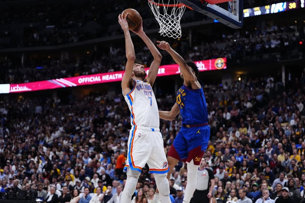 May 9, 2025; Denver, Colorado, USA; Denver Nuggets guard Jamal Murray (27) defends on Oklahoma City Thunder forward Chet Holmgren (7) in the first half during game three of the second round for the 2025 NBA Playoffs at Ball Arena. Mandatory Credit: Ron Chenoy-Imagn Images
