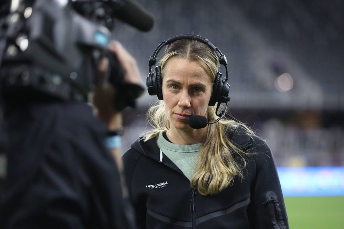 May 9, 2025; Louisville, Kentucky, USA; Racing Louisville FC head coach Bev Yanez does an interview during halftime against Gotham FC at Lynn Family Stadium. Mandatory Credit: EM Dash-Imagn Images