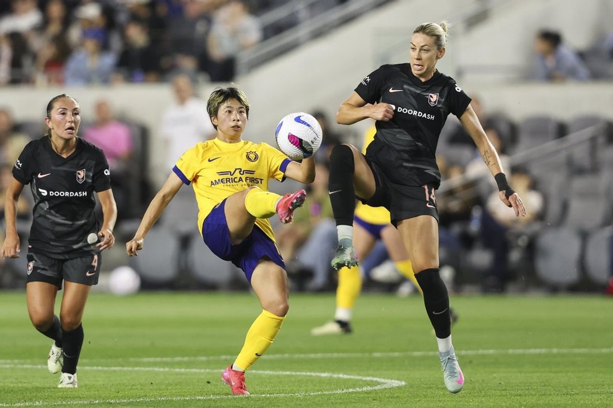 May 9, 2025; Los Angeles, California, USA; Angel City FC defender Alanna Kennedy (14) and Utah Royals forward Mina Tanaka (11) battle for the ball during the first half of a soccer game at BMO Stadium. Mandatory Credit: Jessica Alcheh-Imagn Images