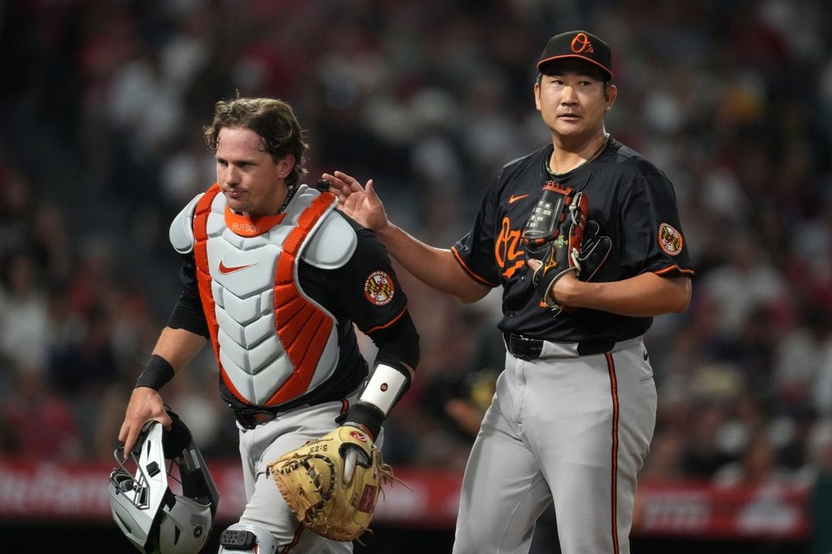 May 9, 2025; Anaheim, California, USA; Baltimore Orioles starting pitcher Tomoyuki Sugano (19) and catcher Adley Rutschman (35) react at the end of the seventh inning against the Los Angeles Angels  at Angel Stadium. Mandatory Credit: Kirby Lee-Imagn Images