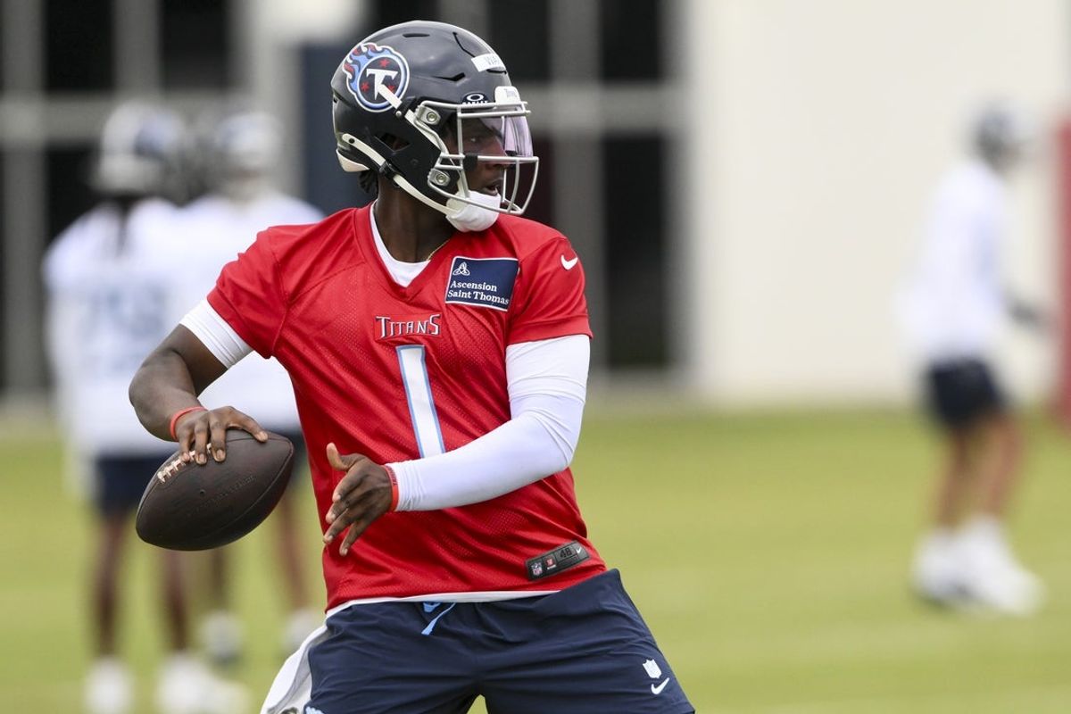 May 10, 2025; Nashville, TN, USA;  Tennessee Titans quarterback Cam Ward (1) throws a pass as he goes through drills during Rookie Mini Camp at Saint Thomas Sports Park. Mandatory Credit: Steve Roberts-Imagn Images
