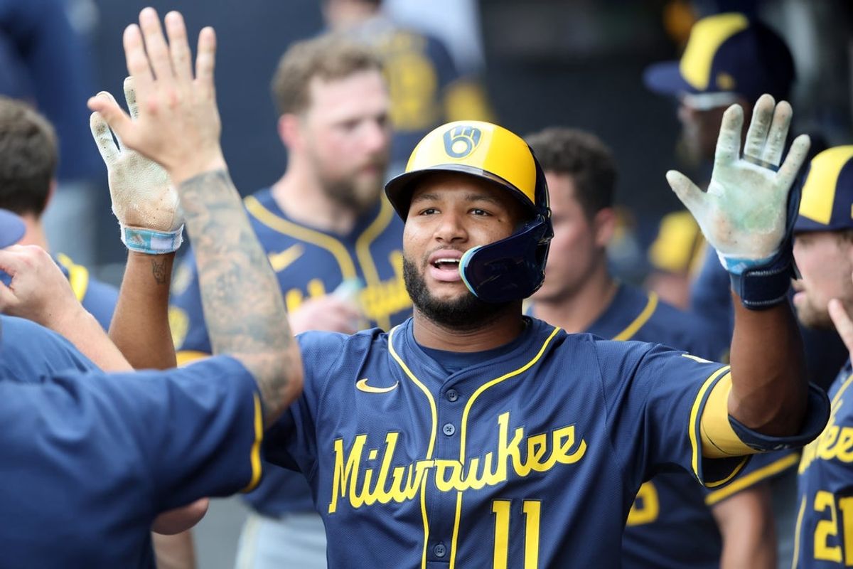 May 10, 2025; St. Petersburg, Florida, USA; Milwaukee Brewers outfielder Jackson Chourio (11) is congratulated in the dugout after he hit a home run against the Tampa Bay Rays during the third inning at George M. Steinbrenner Field. Mandatory Credit: Kim Klement Neitzel-Imagn Images