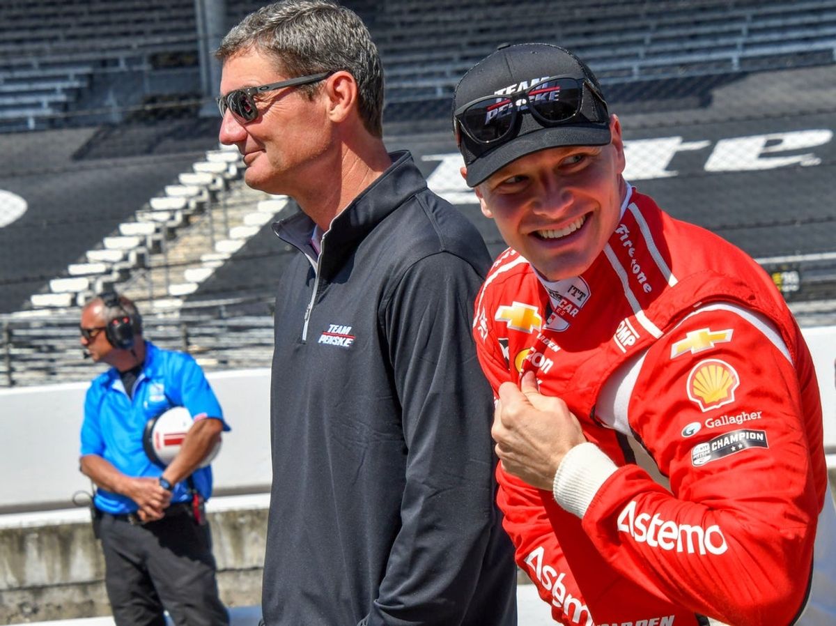 Team Penske driver Josef Newgarden (2) of United States reacts with Penske Team President Tim Cindric at left, Saturday morning, May 10, 2025, during warm-ups and preparations for the Sonsio Grand Prix at Indianapolis Motor Speedway.