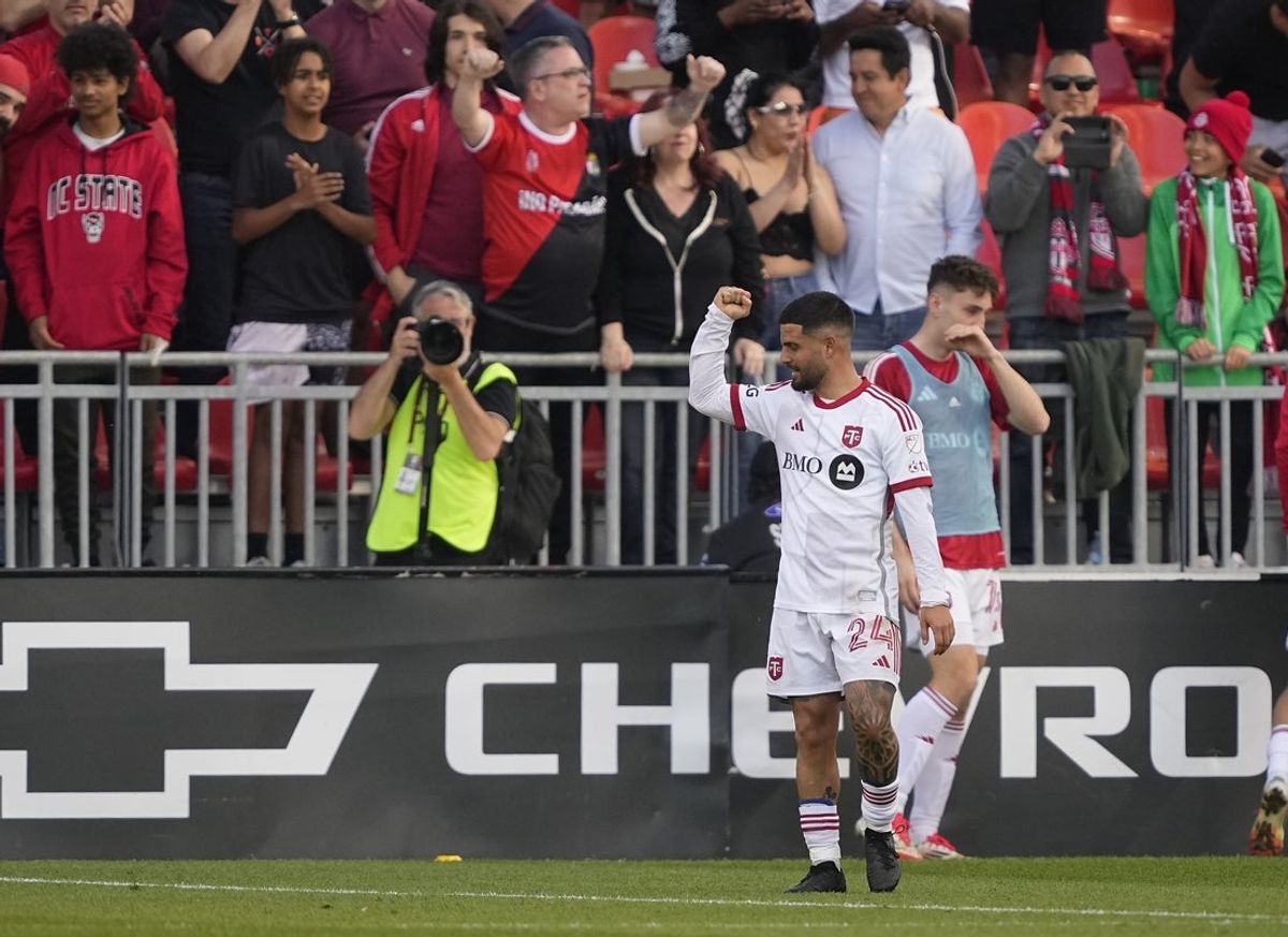 May 10, 2025; Toronto, Ontario, CAN; Toronto FC forward Lorenzo Insigne (24) celebrates an own goal against D.C. United during the second half at BMO Field. Mandatory Credit: John E. Sokolowski-Imagn Images