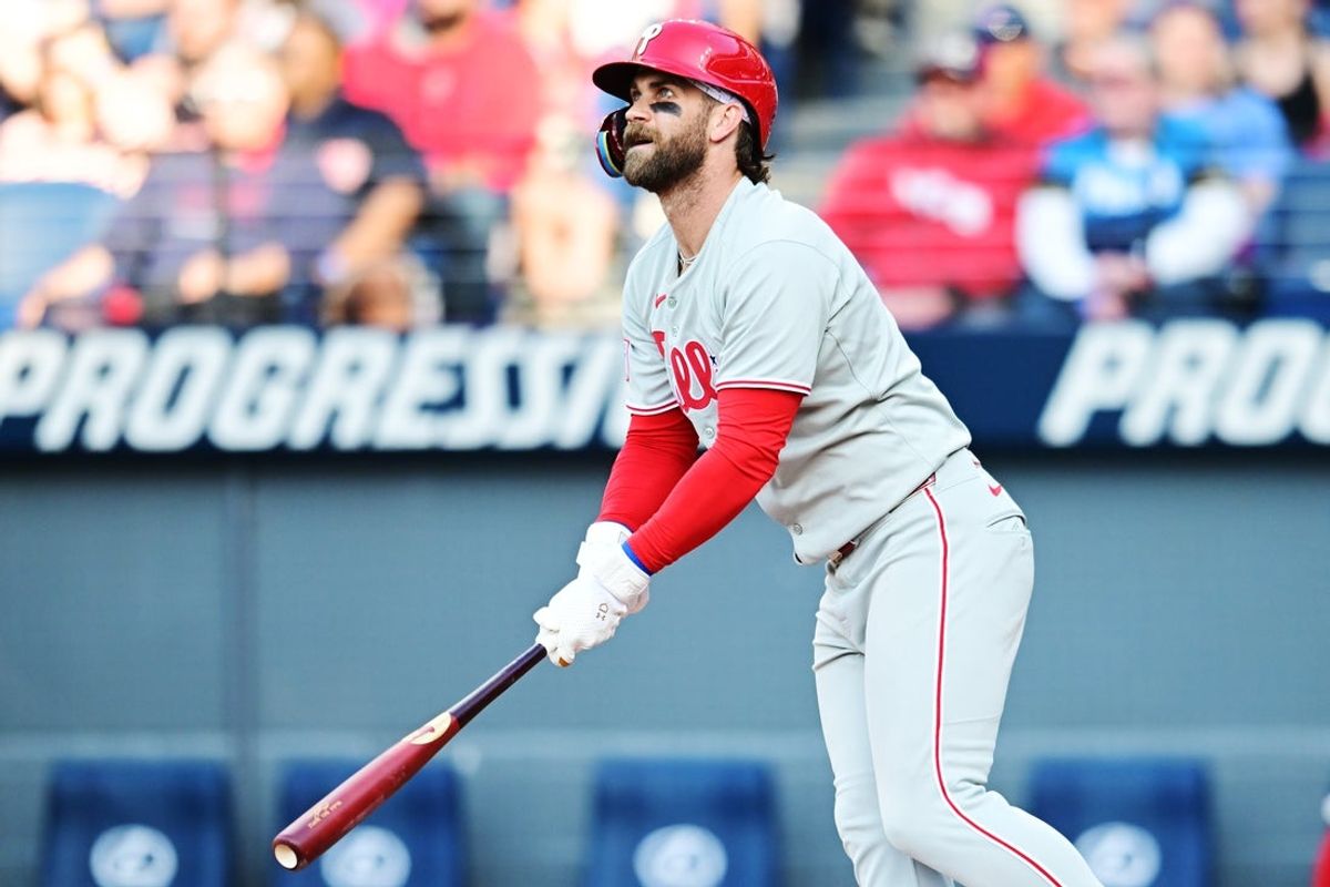 May 10, 2025; Cleveland, Ohio, USA; Philadelphia Phillies first baseman Bryce Harper (3) hits a double during the fourth inning against the Cleveland Guardians at Progressive Field. Mandatory Credit: Ken Blaze-Imagn Images
