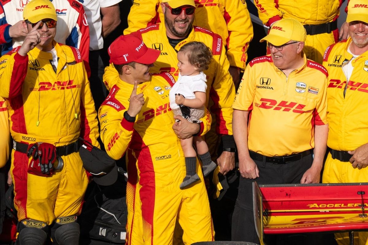 Chip Ganassi Racing driver Alex Palou (10) of Spain reacts with his daughter, Lucia, Saturday, May 10, 2025, after winning the Sonsio Grand Prix at Indianapolis Motor Speedway.