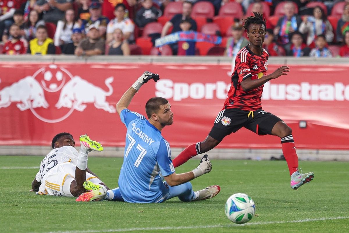 May 10, 2025; Harrison, New Jersey, USA; New York Red Bulls forward Mohammed Sofo (37) kicks the ball wide of net past LA Galaxy goalkeeper John McCarthy (77) and defender Emiro Garces (25) during the first half at Sports Illustrated Stadium. Mandatory Credit: Vincent Carchietta-Imagn Images