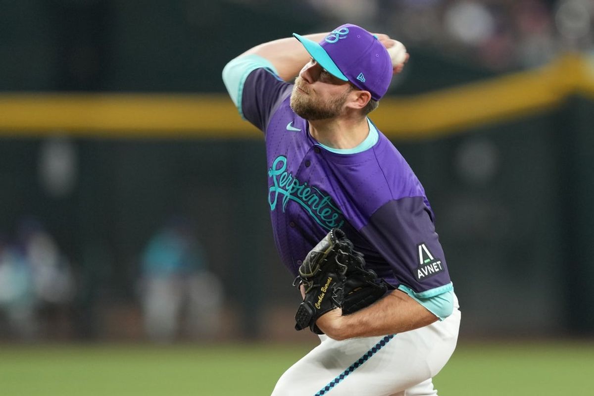May 10, 2025; Phoenix, Arizona, USA; Arizona Diamondbacks pitcher Corbin Burnes (39) pitches against the Los Angeles Dodgers during the first inning at Chase Field. Mandatory Credit: Joe Camporeale-Imagn Images