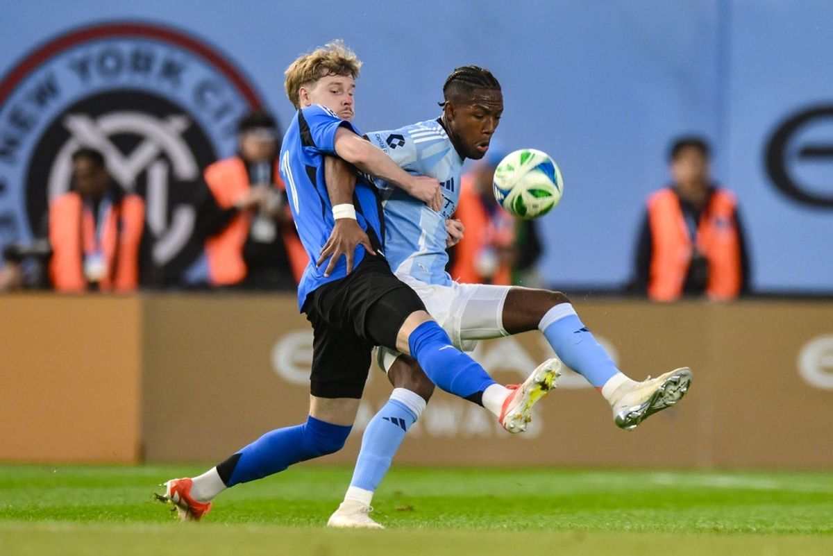 May 10, 2025; New York, New York, USA; New York City midfielder Andrés Perea (8) competes for the ball against CF Montréal defender Dawid Bugaj (27) during the first half at Yankee Stadium. Mandatory Credit: John Jones-Imagn Images