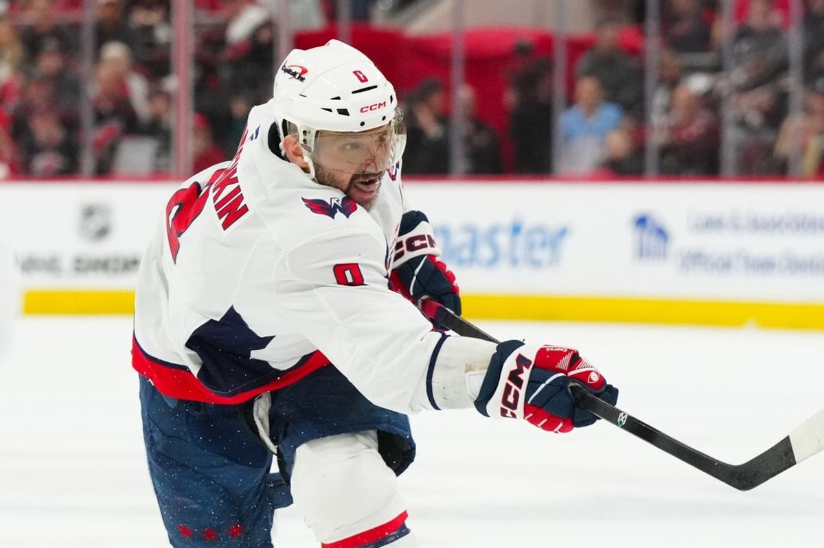 May 10, 2025; Raleigh, North Carolina, USA; Washington Capitals left wing Alex Ovechkin (8) takes a shot against the Carolina Hurricanes during the second period in game three of the second round of the 2025 Stanley Cup Playoffs at Lenovo Center. Mandatory Credit: James Guillory-Imagn Images