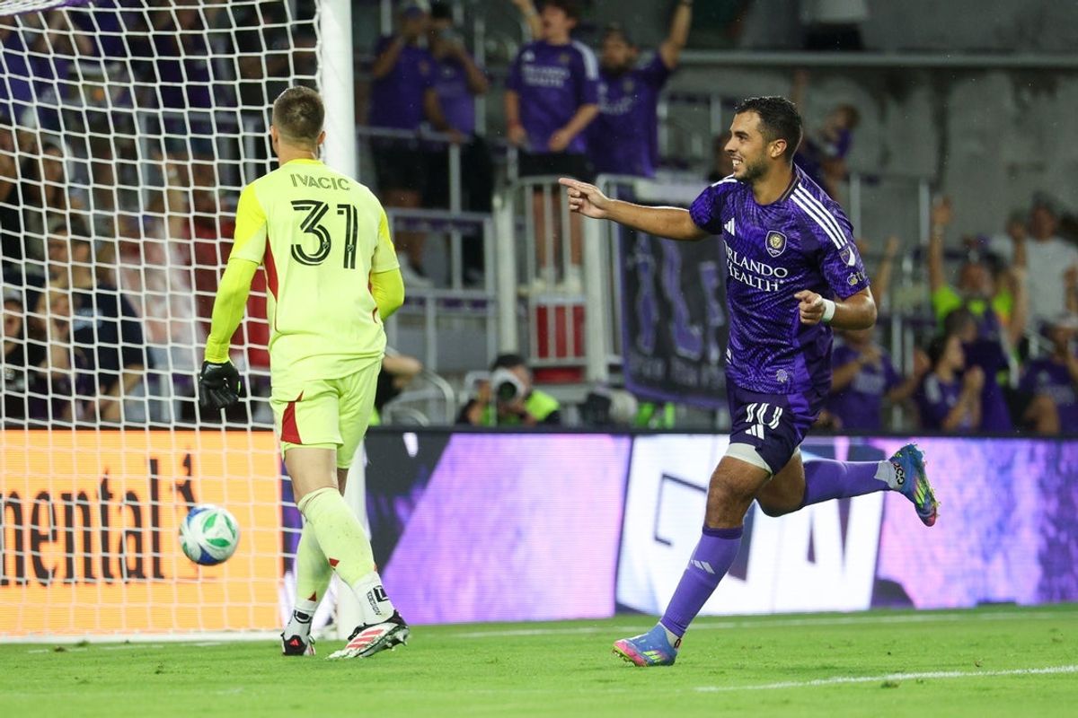 May 10, 2025; Orlando, Florida, USA; Orlando City midfielder Martin Ojeda (10) celebrates after scoring on a penalty kick against New England Revolution goalkeeper Aljaz Ivacic (31) in the second half at Inter&Co Stadium. Mandatory Credit: Nathan Ray Seebeck-Imagn Images