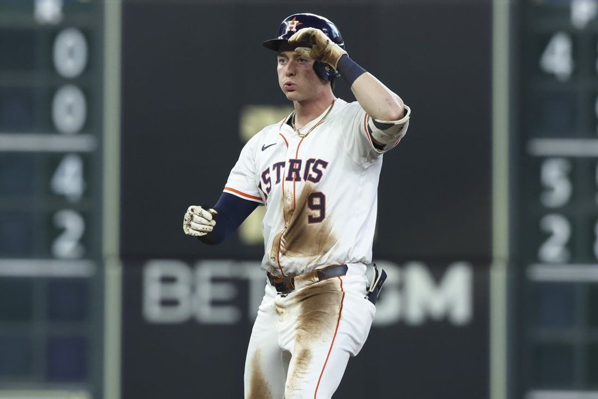 May 10, 2025; Houston, Texas, USA; Houston Astros left fielder Zach Dezenzo (9) reacts after hitting a double during the third inning against the Cincinnati Reds at Daikin Park. Mandatory Credit: Troy Taormina-Imagn Images