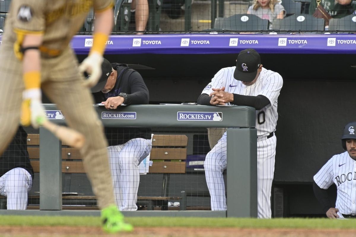 May 10, 2025; Denver, Colorado, USA; Colorado Rockies manager Bud Black (10) stands on the top step of the dugout with his head down during their game against the San Diego Padres at Coors Field. Mandatory Credit: John Leyba-Imagn Images