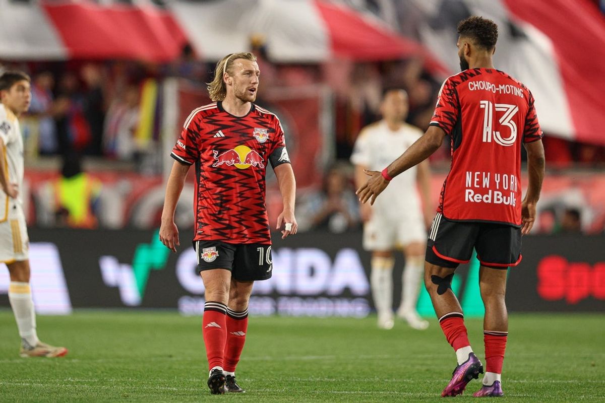 May 10, 2025; Harrison, New Jersey, USA; New York Red Bulls midfielder Emil Forsberg (10) and forward Eric Maxim Choupo-Moting (13) celebrates after there teams fourth goal of the match against the LA Galaxy during the second half at Sports Illustrated Stadium. Mandatory Credit: Vincent Carchietta-Imagn Images